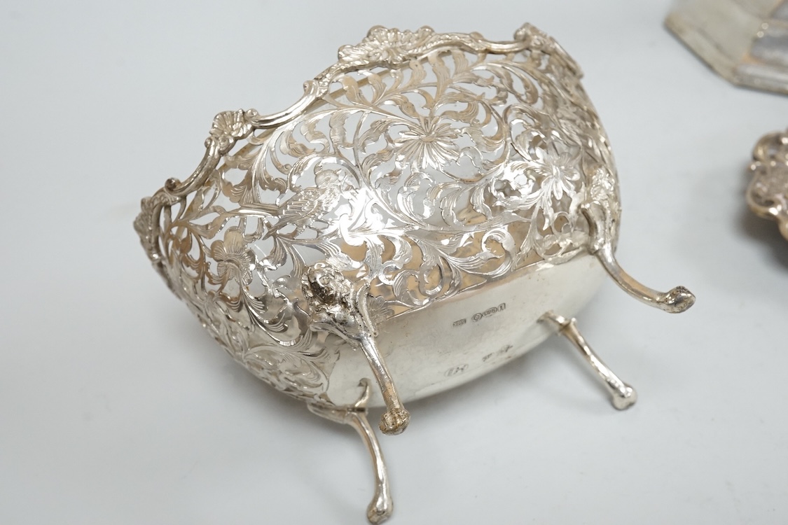 A pair of Edwardian silver mounted octagonal dwarf candlesticks by William Hutton & Sons, London, 1905, 12.7cm, weighted, one lacking sconce, together with a silver pin tray a continental sugar bowl with glass liner and